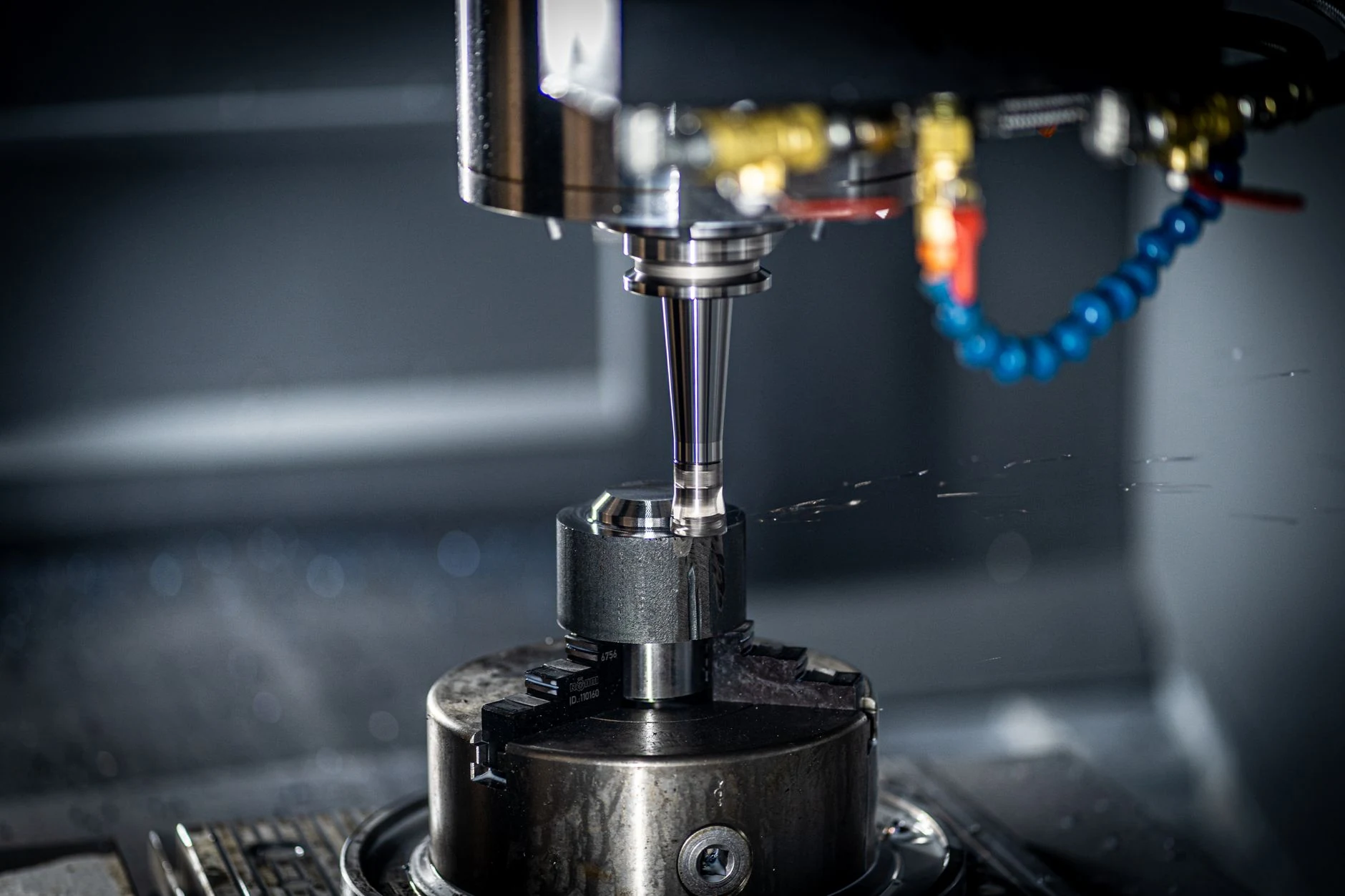 Modern automated factory with CNC machines and industrial production lines.
